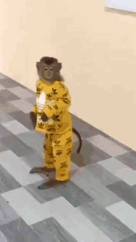 A Monkey Wearing A Yellow Adidas Outfit Is Standing On A Checkered Floor GIF