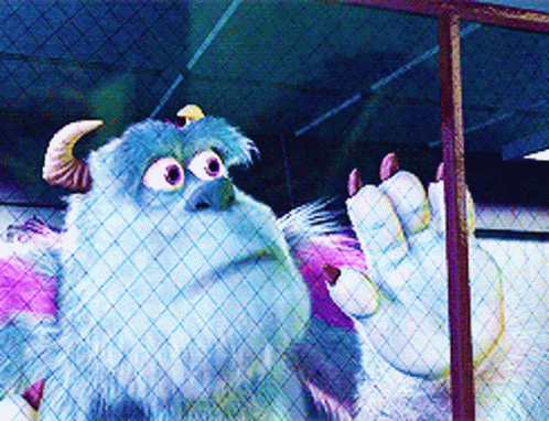 A Monster From The Movie Monsters Inc Is Behind A Fence GIF