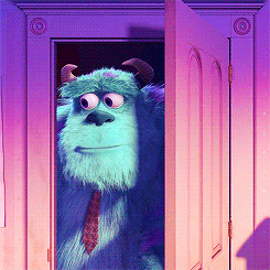 A Monster From The Movie Monsters Inc Is Peeking Out Of A Door GIF