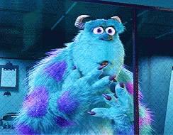 A Monster From The Movie Monsters Inc Is Standing In Front Of A Chain Link Fence GIF