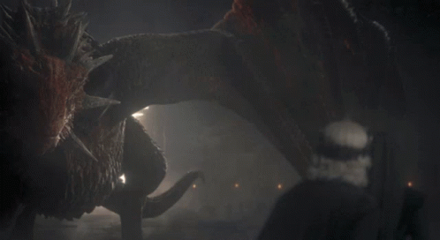 A Monster Is Eating Another Monster In A Cave GIF