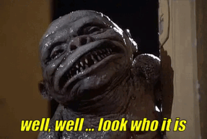 A Monster Is Standing In A Doorway And Says `` Well , Well , Look Who It Is '' . GIF