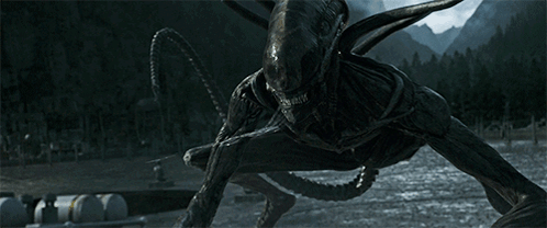 A Monster With A Long Tail Is Standing In The Dark Near A Body Of Water GIF