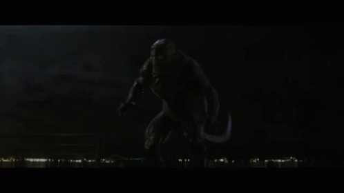 A Monster With Its Mouth Open In The Dark GIF