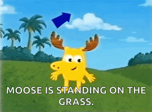 A Moose Is Standing On The Grass With A Blue Arrow Pointing To It GIF
