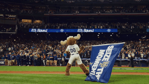 A Moose Mascot Is Holding A Blue Seize The Moment Flag GIF