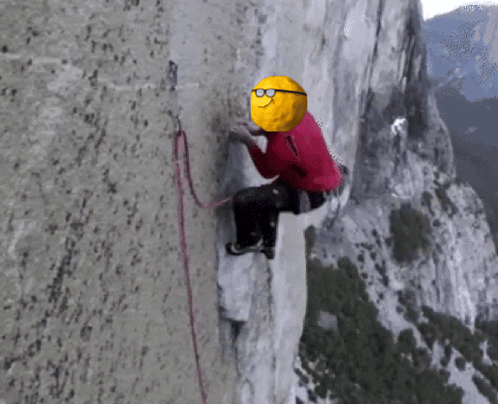 A Mountain Climber With A Yellow Ball On His Head GIF