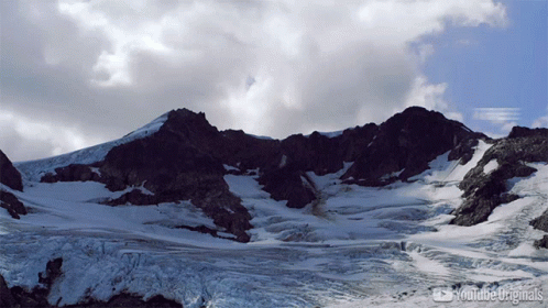 A Mountain Covered In Snow With Youtube Originals Written On The Bottom Right GIF