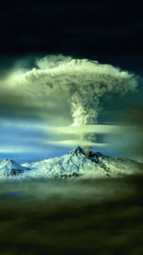 A Mountain With Smoke Coming Out Of It And A Cloud Above It GIF