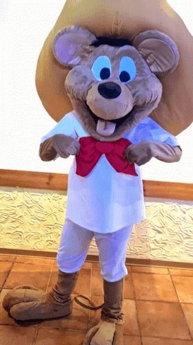 A Mouse Mascot Wearing A White Shirt And A Red Bow Tie GIF