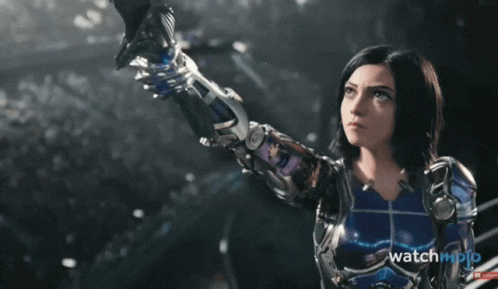 A Movie Poster For " Alita : Battle Angel " Shows A Woman Holding A Sword GIF