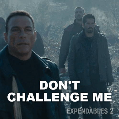 A Movie Poster For Expendables 2 Shows A Man Holding A Gun GIF