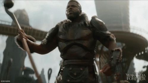 A Movie Poster For Wakanda Forever With A Man In Armor GIF