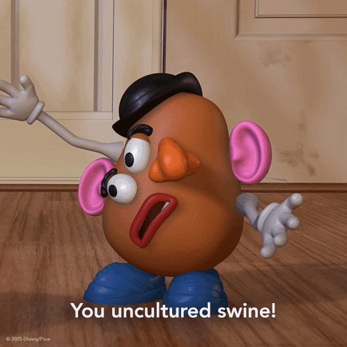 A Mr Potato Head Says " You Uncultured Swine " On A Wooden Floor GIF