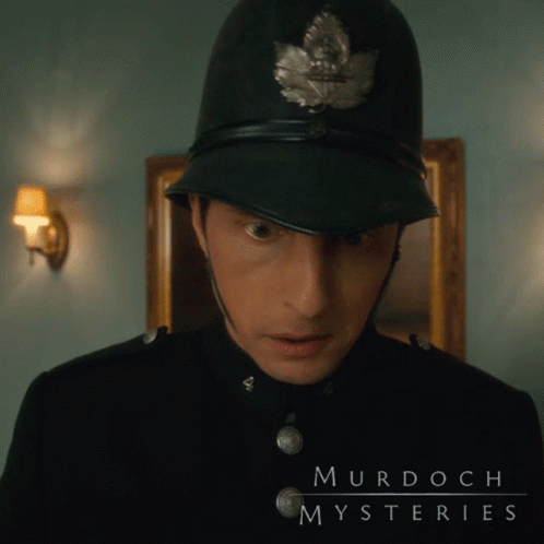A Murdoch Mysteries Poster With A Police Officer GIF