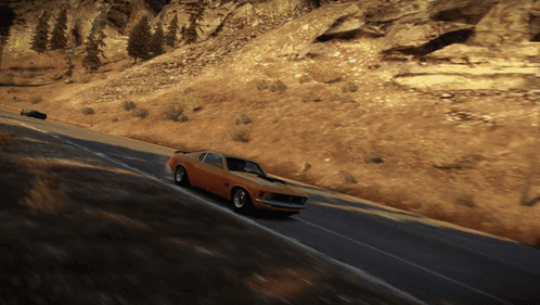 A Mustang Is Driving Down A Road In The Desert GIF
