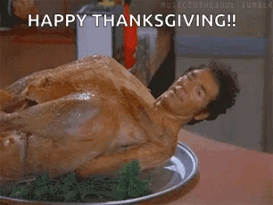 A Naked Man Is Laying On A Plate Of Food With The Words `` Happy Thanksgiving '' . GIF