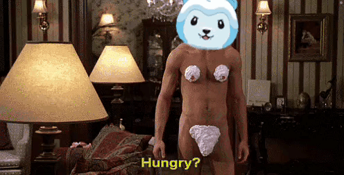 A Naked Man With Whipped Cream On His Chest Is Standing In A Living Room And Says Hungry . GIF