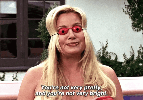 a naked woman wearing red glasses says you 're not very pretty and you 're not very bright