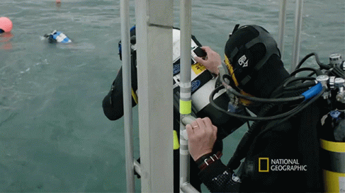 A National Geographic Advertisement With A Scuba Diver On It GIF