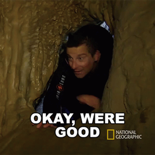 A National Geographic Poster With A Man In A Cave GIF