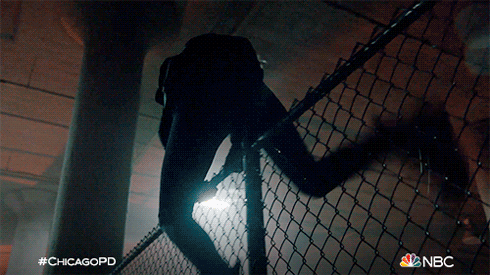 A Nbc Ad For Chicagopd Shows A Man Climbing A Fence GIF