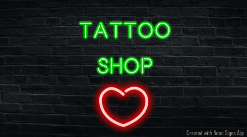 A Neon Sign For A Tattoo Shop With A Heart GIF