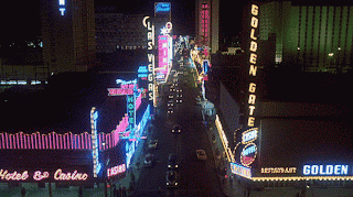 A Neon Sign For The Golden Gate Restaurant Is Lit Up GIF