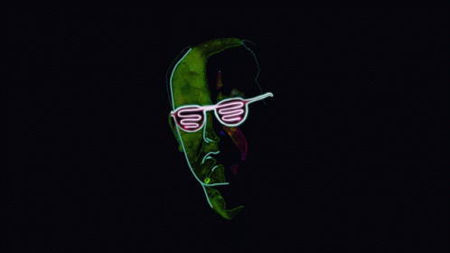 A Neon Sign Of A Man Wearing Sunglasses On A Dark Background GIF