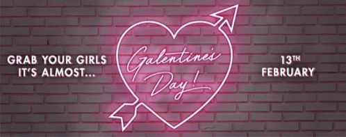 A Neon Sign On A Brick Wall Says Valentine 'S Day GIF