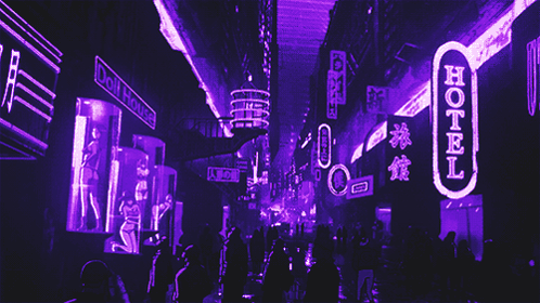 A Neon Sign That Says Hotel Is Lit Up At Night GIF