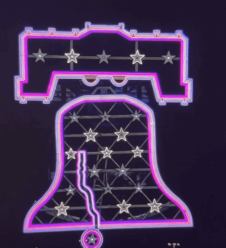 A Neon Sign That Says Liberty Bell With Stars On It GIF