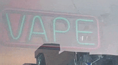 a neon sign that says vape in green
