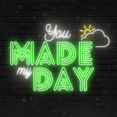 A Neon Sign That Says " You Made My Day " On A Brick Wall GIF