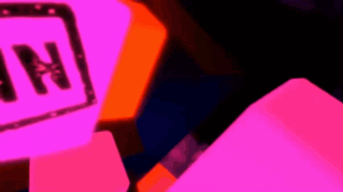 A Neon Sign With The Letter N On It In A Dark Room GIF