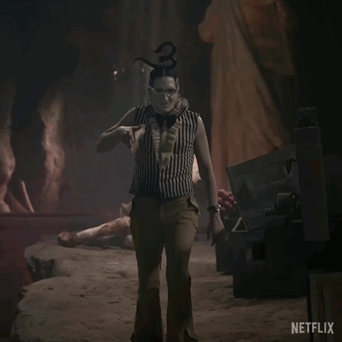 A Netflix Ad Shows A Clown Holding A Large Sword GIF