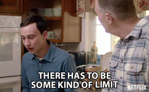 A Netflix Ad Shows A Man Talking To Another Man In A Kitchen GIF