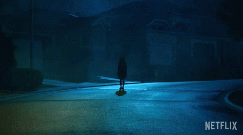 A Netflix Ad Shows A Silhouette Of A Person Standing In The Dark GIF