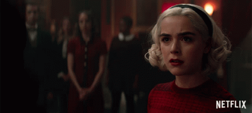 a netflix ad shows a woman in a red sweater