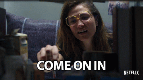 A Netflix Ad Shows A Woman Pointing At Something GIF