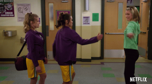 Three Women In Purple Sweatshirts Netflix Ad GIF