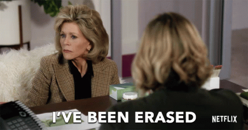 A Netflix Ad Shows Two Women Sitting At A Desk GIF