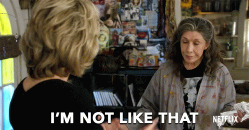 A Netflix Ad Shows Two Women Talking And One Of Them Says " I 'M Not Like That " GIF