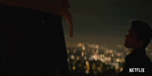 A Netflix Advertisement Shows A Man Holding A Key GIF