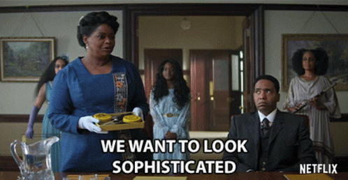 A Netflix Advertisement Shows A Woman Holding A Tray Of Cookies GIF
