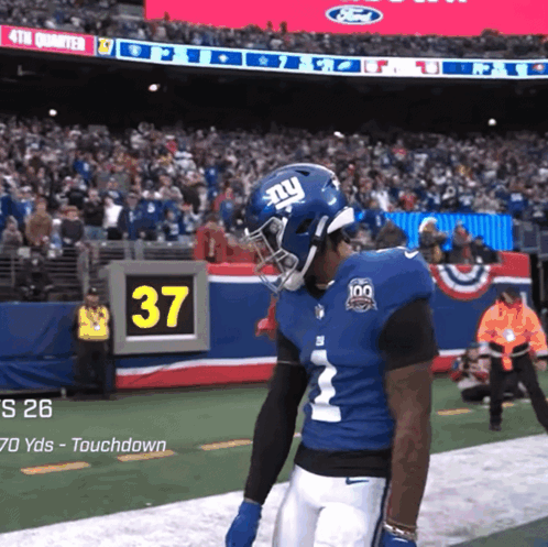 A New York Giants Player Stands On The Field GIF