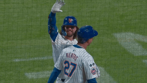 A New York Mets Baseball Player Is Waving His Hand GIF