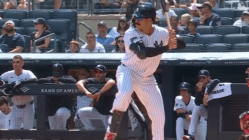 A New York Yankees Baseball Player Getting Ready To Swing At A Pitch GIF