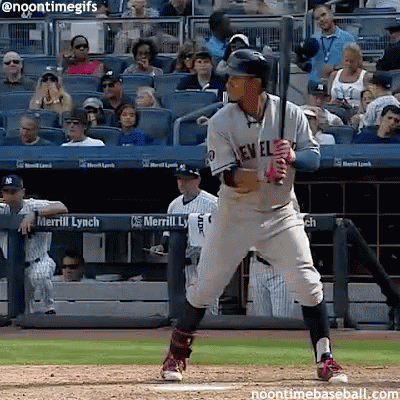 A New York Yankees Baseball Player Getting Ready To Swing At A Pitch GIF