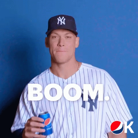 A New York Yankees Baseball Player Holding A Pepsi Can GIF